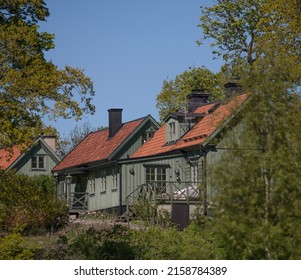 Green Wood Houses In A Forest Glade On The Island Djurgården A Sunny Day In Stockholm, Sweden 2022-05-19