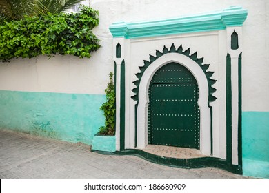 Green wooden gate of ancient mosque in Medina. Tangier, Morocco