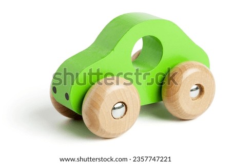 Green wooden toy car with abstract background