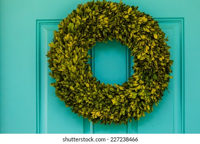 Green Wreath Decorating Front Door.