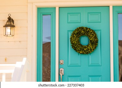 Green Wreath Decorating Front Door.