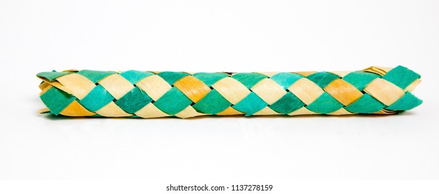 Green And Yellow Bamboo Finger Cuffs. Isolated.