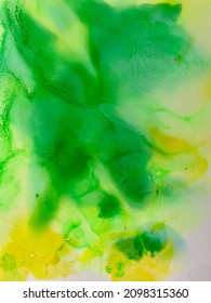 green yellow and blue alcohol ink watercolour background in bled green yellow gradient tones