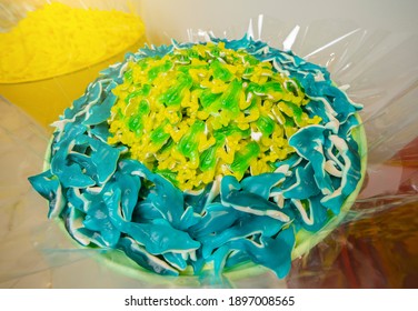 Green And Yellow Gummy Candy Frog And Blue Sharks