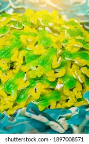 Green And Yellow Gummy Candy Frog And Blue Sharks