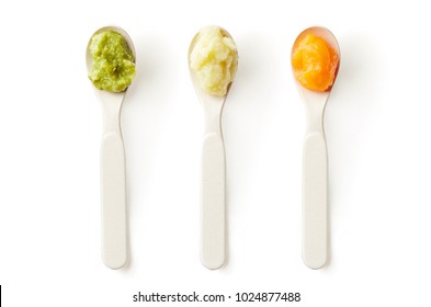 Green, Yellow And Orange Baby Puree In Baby Spoon Isolated On White Background, Top View