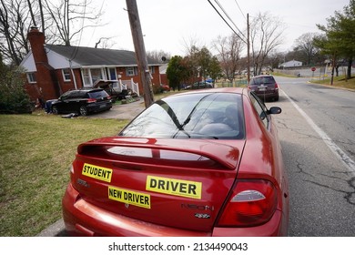 Greenbelt, Maryland - USA - March 03, 2022:  Red Car With Yellow Stickers 