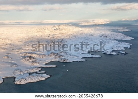 Greenlandic ice cap with frozen mountains and fjord aerial view, near Nuuk, Greenland