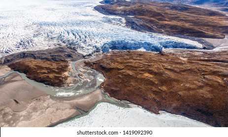 Greenlandic Ice Sheet Melting Glacier Into River With Tundra Aerial View, Near Kangerlussuaq, Greenland