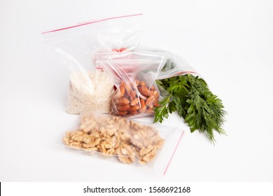 Greens And Nuts Packing In Zip Lock On A White Background