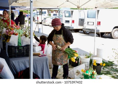 Greensboro,N.C./USA 04212018: 
Making Flower Arrangements At The Piedmont Triad Farmers Market On A Saturday Afternoon