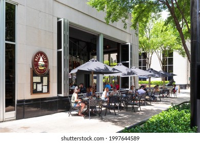 GREENVILLE, SC, USA-23 JUNE 2021: Nose Dive Pub, showing diners at sidewalk tables.