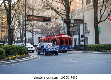 Greenville, South Carolina / USA - February 19, 2018: a beautiful street in the city. Public and private transport at the crossroads.