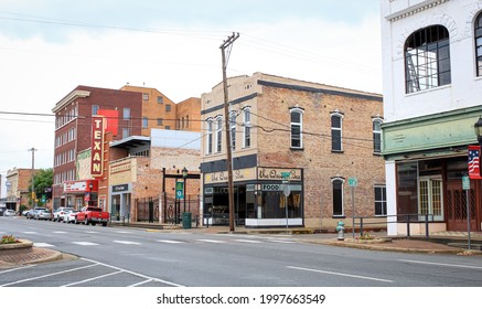 Greenville, Texas United States - June 1 2021: a view of the main street theater on a cloudy day