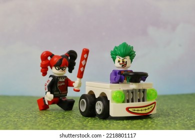 GREENVILLE, UNITED STATES - Jun 02, 2022: Mini Figure Playing, Having Fun And Smiling   Male And Female Riding In A Car   Colorful Bricks, Red Hair, Green Hair 