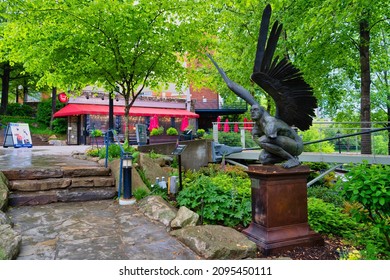 GREENVILLE, UNITED STATES - May 04, 2021: A statue in the Falls Park on the Reedy River in Greenville, South Carolina, USA