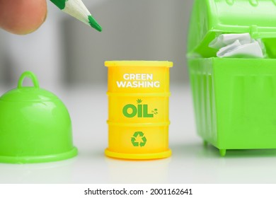 Greenwashing Concept. Oil Barrel With Recycle Symbol And Green Text. Greenwashing Is A Communication Technique Aimed At Building A False Image Of A Company In Terms Of Environmental 