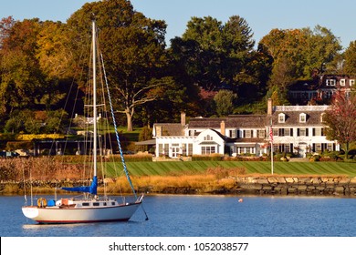 Greenwich, CT, USA October 27 A Sailboat Is Moored Just Off Shore Of A  Luxury Waterfront Home In Greenwich, Connecticut.  Greenwich Is Considered One Of The Wealthiest Towns In America