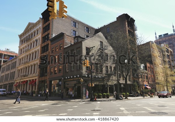 Greenwich village, New York City - April 21, 2016 : \
Street scene of Greenwich Village street. Greenwich Village is a\
largely residential neighborhood in Lower Manhattan, New York,\
USA