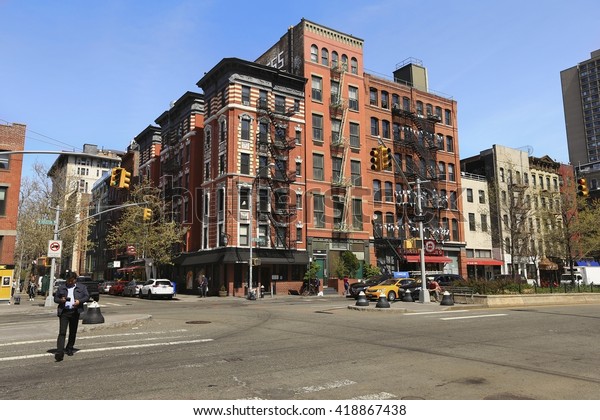 Greenwich village, New York City - April 21, 2016 : \
Street scene of Greenwich Village street. Greenwich Village is a\
largely residential neighborhood in Lower Manhattan, New York,\
USA