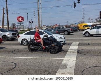 Greenwood, Indiana United States - April 06 2020: A Man On A Motorcycle Busy Street Road