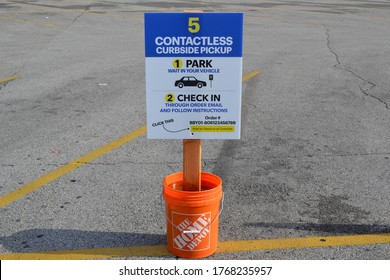 Greenwood, Indiana / United States - July 2 2020: Contactless Curbside Pickup Delivery Signage - Parking Lot