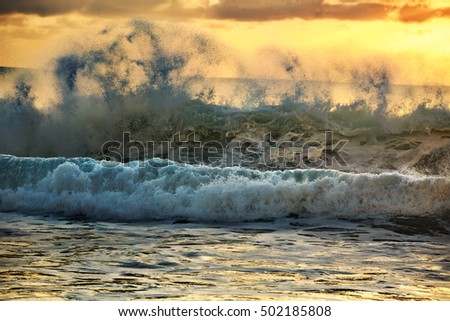 GreenYellow Blue sunset rough shorebreak ocean wave on orange background. Sea pattern marine template for travel design