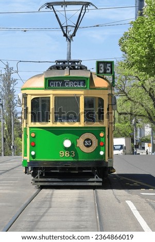 Green-yellow W8-class electric tram operating on the zero-fare, number 35 City Circle tourist route. The W-class was introduced in 1923 by MMTB and has seen several updates. Melbourne-VIC-Australia.
