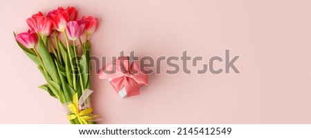 Greeting card. Bouquet of colorful tulip flowers gift box on pink, copy space, invitation card. Spring time seasonal holiday, 8 march International woman day, Mother day, banner, flyer