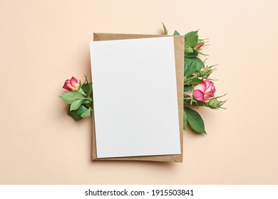 Greeting card with fresh roses flowers on paper background - Shutterstock ID 1915503841