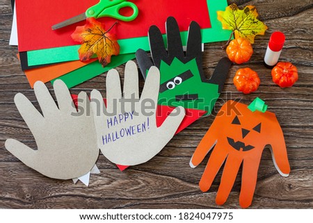 Greeting card halloween on wooden table. Children's creativity project, crafts, crafts for kids.