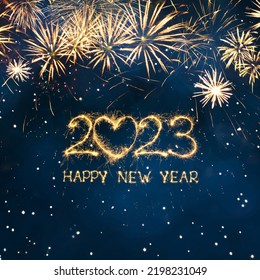 Greeting card Happy New Year 2023. Beautiful Square holiday web banner or billboard with Golden sparkling text Happy New Year 2023 written sparklers on festive blue background.