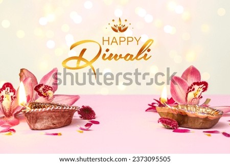 Greeting card for Indian holiday Diwali (Festival of lights) with diya lamps and flowers