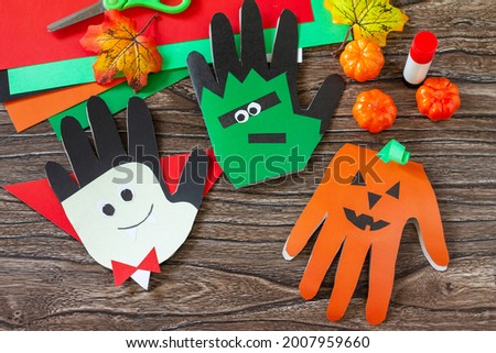 Greeting card with the inscription that happy halloween on wooden table. Children's creativity project, crafts, crafts for kids.