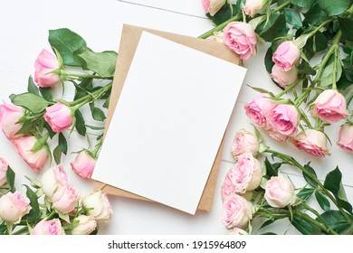 Greeting Card Mockup With Fresh Roses On White Wooden Background, Mockup With Copy Space