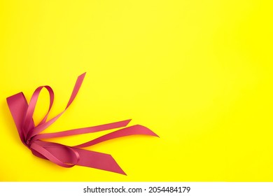 Greeting Card Mockup With Gentle Purple Bow On Yellow Background.