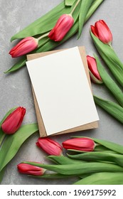 Greeting Card Mockup With Red Tulip Flowers On Grey Concrete Background, Copy Space