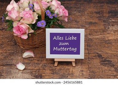 Greeting card for Mother's Day: basket with roses and congratulations on Mother's Day. German inscription translated means Happy Mother's Day. - Powered by Shutterstock