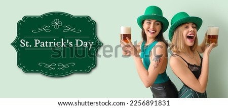 Greeting card for St. Patrick's Day with beautiful young women drinking beer
