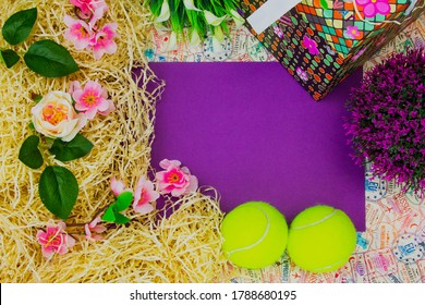 A greeting card for a tennis player, a lilac leaf in the middle, around the leaf with a place to copy tennis balls, buckets, flowers and hay. - Powered by Shutterstock