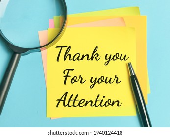 Greeting Concept. Phrase THANK YOU FOR YOUR ATTENTION Written On Sticky Note With A Pen And Magnifying Glass.