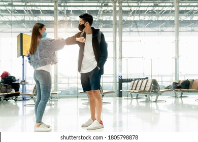 Greeting Friend Traveller Casual Cloths Say Hi With Elbow And Feet Touch To Say Hello New Way Of Life New Normal Lifestyle In Terminal Airport