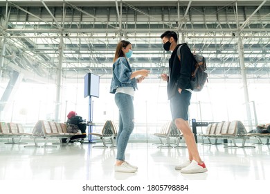 Greeting Friend Traveller Casual Cloths Say Hi With Elbow And Feet Touch To Say Hello New Way Of Life New Normal Lifestyle In Terminal Airport