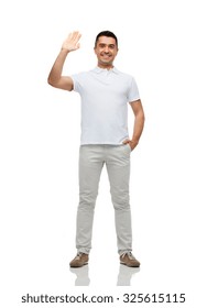 Greeting, Gesture And People Concept - Smiling Man In Blank White T-shirt Waving Hand