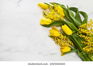 Greeting for International Women's Day on March 8th. Branches of mimosa and tulips