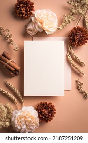 Greeting or invitation blank card, wheat and rose flowers on craft brown background, copy space. Stylish creative autumn fall mock up, autunm holiday celebration concept. - Shutterstock ID 2187251209
