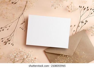 Greeting or invitation card mockup with envelope and dry natural plants twigs