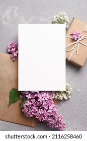 Greeting Or Invitation Card Mockup With Gift Box, Envelope And Spring Lilac Flowers