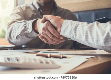 Greeting New Colleagues Team, Business People Shaking Hands During A Meeting To Sign Agreement And Become A Business Partner, Successful Businessman Handshake After Good Deal For Both Companies.