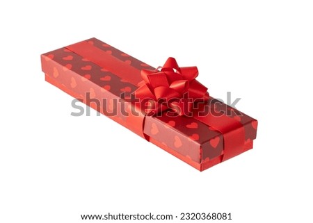 Greeting red long gift box with hearts and ribbon isolated on white background.
